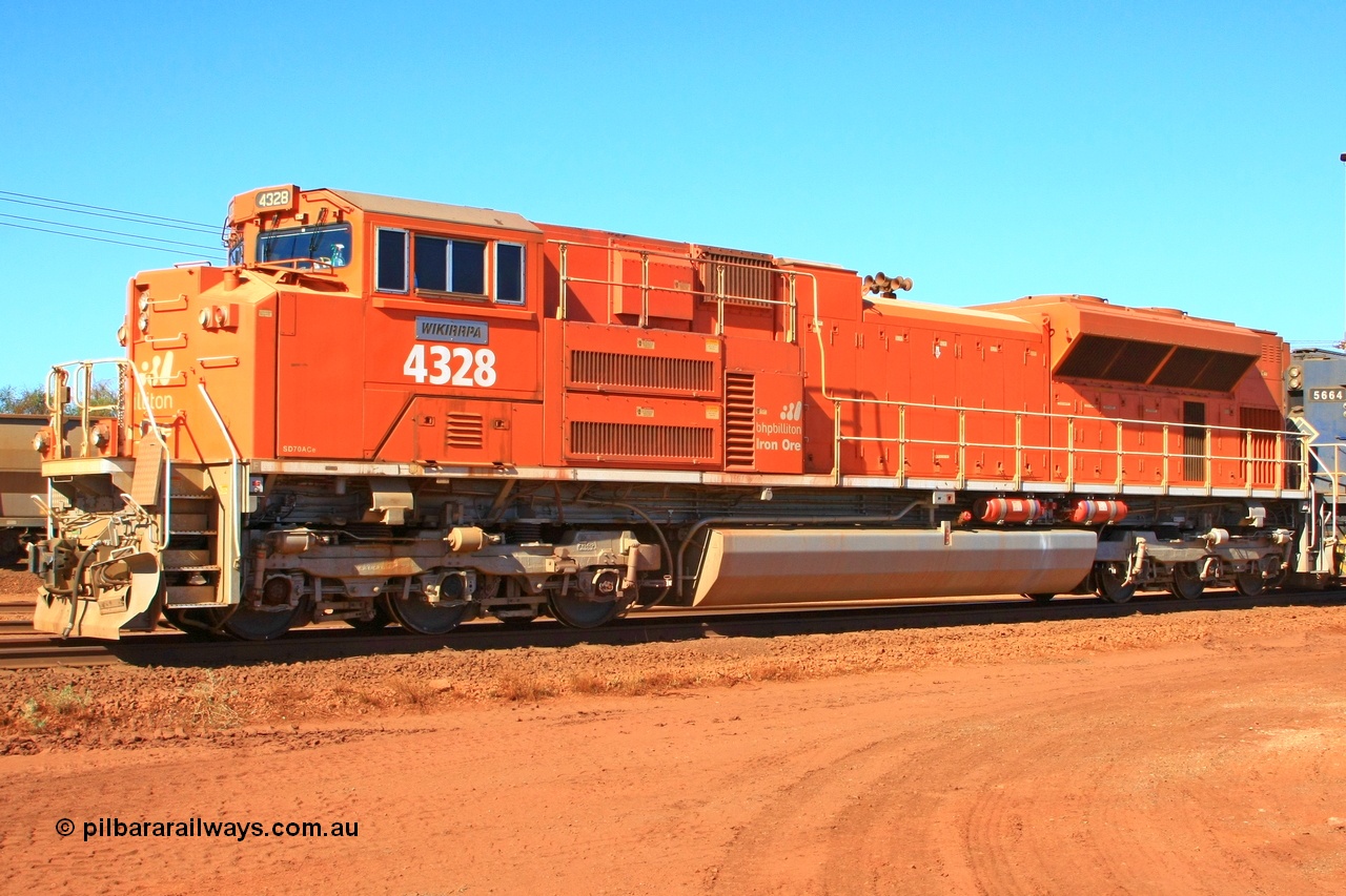 100508 8319r
Nelson Point, BHP Billiton 'Pumpkin' unit 4328 was built by Electro-Motive as an EMD model SD70ACe for the BNSF railroad in the USA with serial 20066862-057 but was sold to BHP while under construction as one of ten similar units to be diverted to BHP in an all over BNSF base orange earning them the nickname of 'pumpkins' after the BNSF livery. They were standard US domestic units and required substantial modifications to be afforded lead unit status for BHP. This view shows the tropical roof, marker lights, fire suppression tanks and dual handrail. 8th May 2010.
Keywords: 4328;Electro-Motive-London-Ontario;EMD;SD70ACe;20066862-057;BNSF-9186;