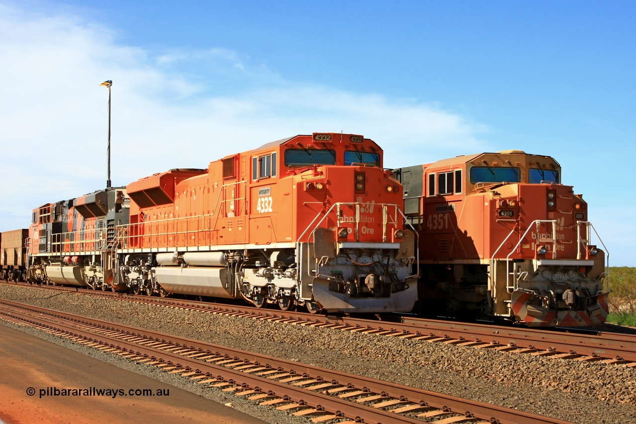 110208 9356r
Bing Siding, empty trains lined up awaiting departure time with a display of a standard BHP Billiton EMD SD70ACe 4351 'Broken Hill' serial 20088019-005 and a modified domestic USA EMD SD70ACe 4332 'Integrity' serial 20066862-061, both units were built at London Ontario by Electro-Motive, 4332 has been modified as a lead unit by a number of modifications like dual handrail, bifurcated hose bag, tropical roof, marker lights of which all of these are visible. 8th February 2011.
Keywords: 4332;Electro-Motive-London-Ontario;EMD;SD70ACe;20066862-061;BNSF-9190;