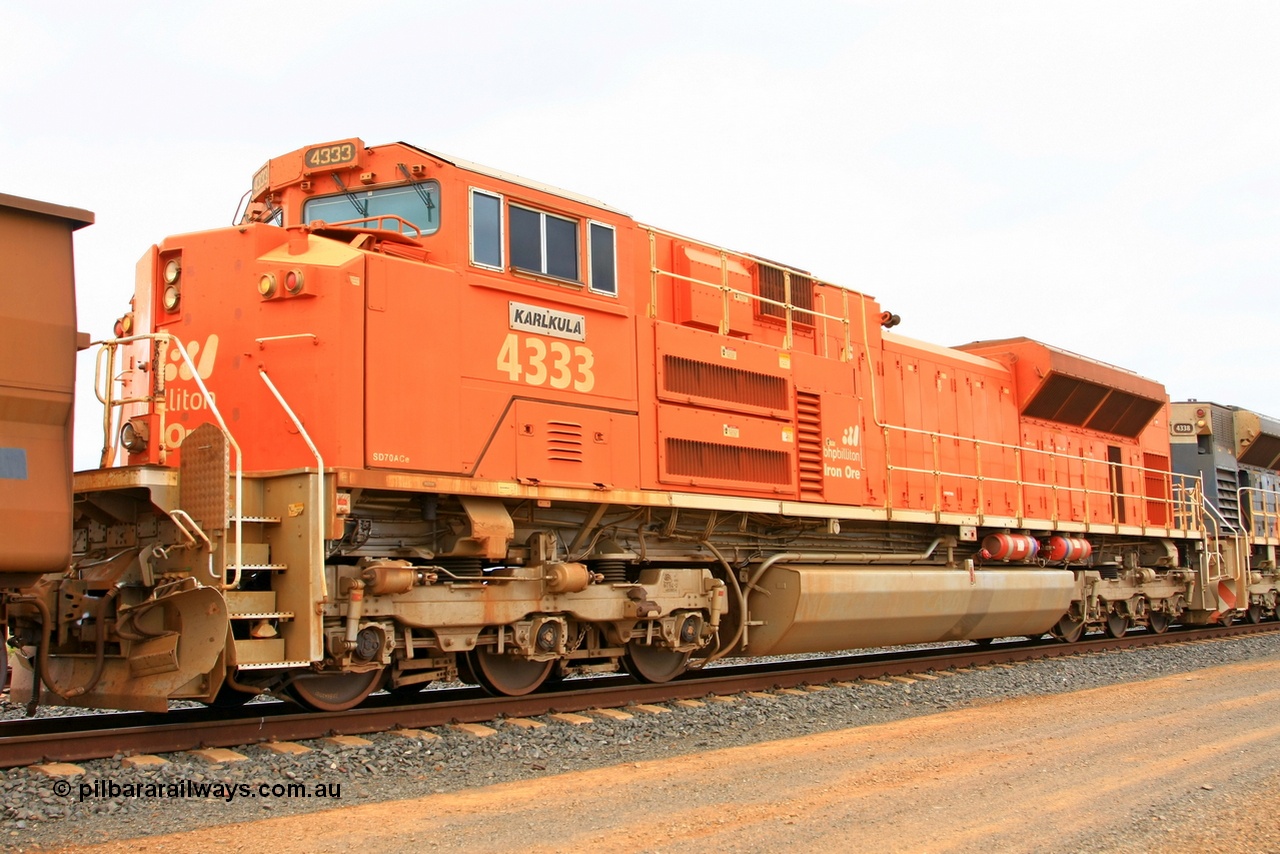 110406 9788r
Goldsworthy Junction on the Avoidance Road is second unit BHP Billiton Electro-Motive of London Ontario built EMD model SD70ACe locomotive 4333 'Karlkula' with serial 20066862-062 was a standard USA domestic ordered for BNSF railroad but diverted and sold to BHP, ten units completed this order and 4333 has been modified to a lead unit by a number of modifications like dual handrail, bifurcated hose bag, tropical roof, marker lights and fire suppression of which all of these are visible in this view. 6th April 2011.
Keywords: 4333;Electro-Motive-London-Ontario;EMD;SD70ACe;20066862-062;BNSF-9191;