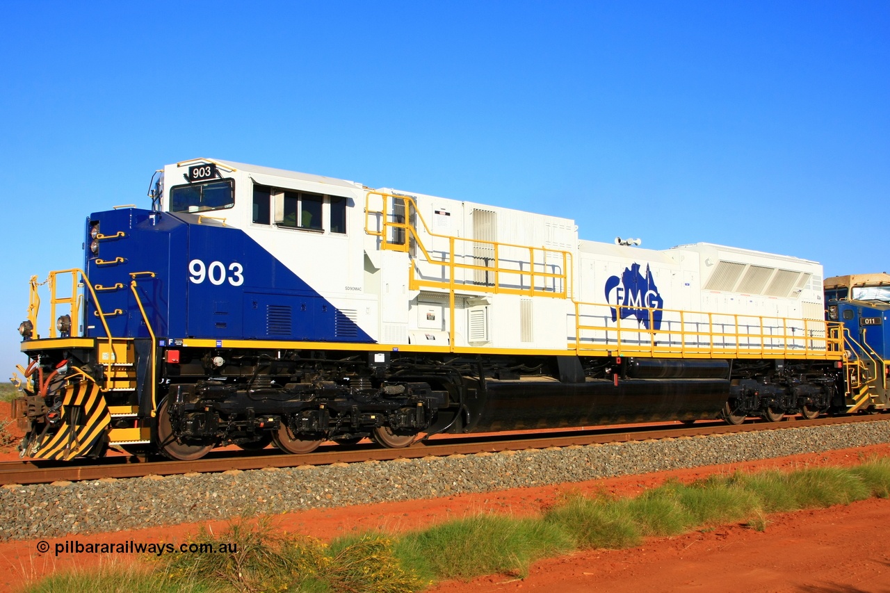 110601 1186r
Rowley Yard, the first mainline lead run of FMG Electric-Motive Division built SD90MAC-H locomotive 903 serial 976833-18 was originally UP 8539 built in 1999, rebuilt by NS Juniata Shops in 2011 for FMG seen here operating with the 6000 hp 265-H engine. 1st June 2011.
Keywords: FMG-903;NS-Juniata-Shops-USA;EMD;SD90MAC-H2;976833-18;