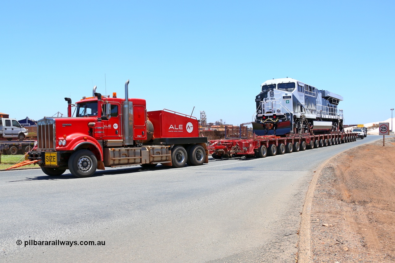 150129 7443
Port Hedland, Roy Hill's General Electric built ES44ACi unit RHA 1013 serial 62585 is their first locomotive to be delivered off the vessel Ocean Charger and being transported by ALE to Roy Hill's flash butt yard. Seen here leaving the Port Hedland port. 29th January 2015.
Keywords: RHA-class;RHA1013;GE;ES44ACi;62585;