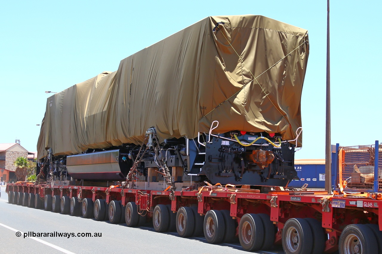 150131 7690
Port Hedland, Wilson Street, view of Roy Hill's General Electric built ES44ACi unit RHA 1014 serial 62586 still under tarp during delivery 31st January 2015.
Keywords: RHA-class;RHA1014;GE;ES44ACi;62586;