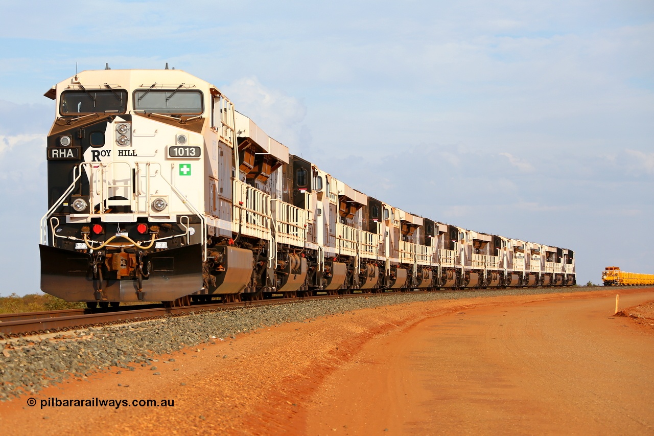 150412 7929r
Boodarie, north of the Flash Butt yard, Roy Hill's General Electric built ES44ACi units lined up on the mainline facing the port. RHA 1013 serial 62585, RHA 1012, RHA 1011, RHA 1010, RHA 1009, RHA 1014, RHA 1005, RHA 1006, RHA 1007, RHA 1008, RHA 1003, RHA 1004, RHA 1002 'Ginbata' and RHA 1001 'Ginny'. With a track supply train rake behind them. 12th April 2015. [url=https://goo.gl/maps/QVHp1]View map here[/url].
Keywords: RHA-class;RHA1013;GE;ES44ACi;62585;