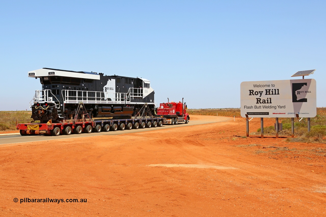 151231 9749r
Boodarie, Roy Hill's General Electric built ES44ACi loco RHA 1016 serial 63827 being delivered past the Roy Hill sign along the access road to their Flash Butt Welding Yard. 31st December 2015. [url=https://goo.gl/maps/qg2swhUsCp32]View map here[/url].
Keywords: RHA-class;RHA1016;GE;ES44ACi;63827;