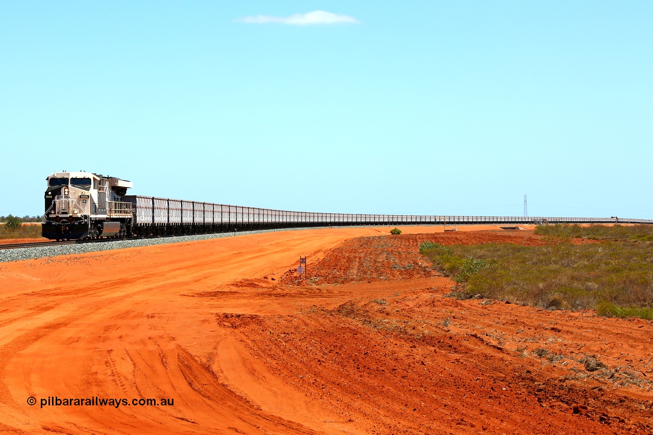 160319 1907
Great Northern Hwy, 18.2 km grade crossing, Roy Hill empty train #96 with General Electric built ES44ACi unit RHA 1006 serial 62578 leading 116 ore waggons with a mid-train unit visible then another 116 ore waggons. 16th March 2016. [url=https://goo.gl/maps/nEXZaaAHHa12]View map here[/url].
Keywords: RHA-class;RHA1006;GE;ES44ACi;62578;