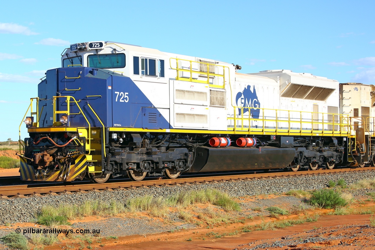 200410 5143r
Boodarie, FMG's Electro-Motive Diesel built SD70ACe-P6 locomotive 725 serial 20188761-004 built 2019, delivered February 2020. This order for ten units are standard US 'domestic' models with the 16-710G3C-T3 at 4500 horsepower and one inverter per axle hence the '-P6' and were fitted with the extra handrails and other refinements like the fire suppressant tanks and bifurcated air pipe here in Port Hedland, other points of difference include only one cow plough on short hood end, ditch lights on both ends, standard US air horn and no marker lights. 10th April 2020.
Keywords: FMG-725;Progress-Rail-Muncie-USA;EMD;SD70ACe-P6;20188761-004;