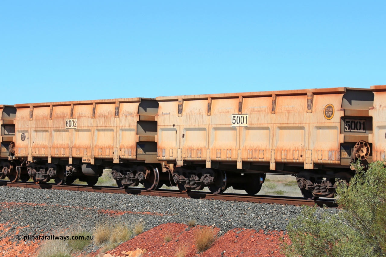 5001-6002 140806 5154
FMG 5001 and 6002 at Wodgina Rd on an empty train, August 6, 2014. Stencilled numbers suggest renumbered on delivery, 5003 and 6004 also had stencilled numbers. Follow on order for 744 waggons 5001 slave and 6002 control, up to 5743 slave and 6744 control built by CNR QRRS Qiqihar Railway Rolling Stock Co. Ltd.

