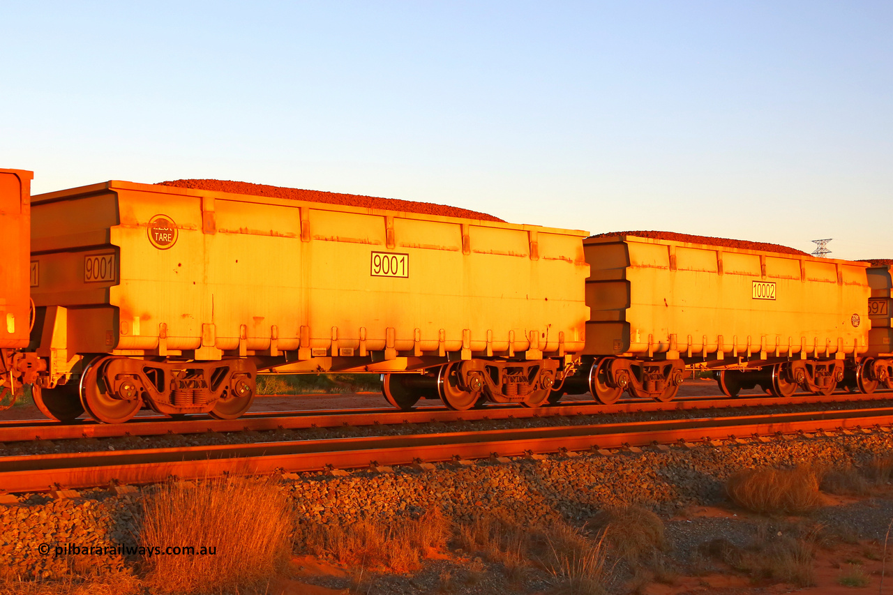 9001-10002 210512 1847
FMG 9001 and 10002 at Boodarie on a loaded train, May 12, 2021. 104 waggons numbered from 9001 slave and 10002 control, up to 9103 slave and 10104 control built by CRRC Yangtze in 2020 with the ribbed body style.
