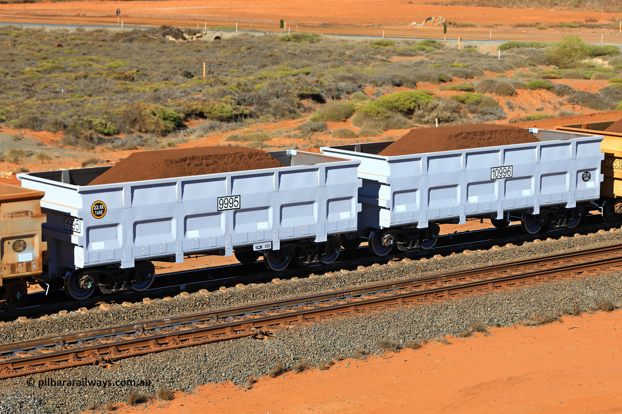 9995-10996 240622 2929
FMG 9995 and 10996 on a loaded train at Kanyirri Yard, June 22, 2024. 338 waggons numbered from 9659 slave and 10660 control, up to 9995 slave and 10996 control built by CRRC Qiqihar in 2023 and 2024, with the CNR style body at 22.5 tonne tare.
