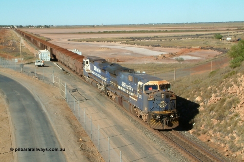 040802 090026r
Redbank, Nelson Point yard entrance BHP GE AC6000 6077 'Nimingarra' serial 51069 and Goninan CM40-8M rebuild 5654 'Kashima' serial 8412-11/93-145 arrive in Nelson Point with a loaded Yandi, of note was the mid-train engines EMD SD40R units 3090-3089 and CM40-8M 5636 had engineers on-board to carry out tests on the SD40R locomotives 2nd August 2004.
Keywords: 6077;GE;AC6000CW;51069;