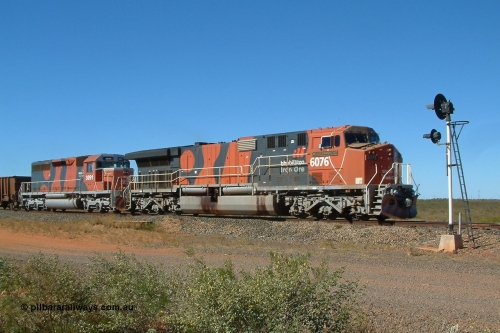 040803 142716r
Goldsworthy Junction, BHP Billiton GE AC6000 6076 'Mt Goldsworthy' serial 51068 leads EMD SD40R 3091 serial 31496 originally Southern Pacific SD40 SP 8415 at signal TR13 (transfer road switch, Goldsworthy Junction) with an empty train 3rd August, 2004.
Keywords: 6076;GE;AC6000CW;51068;