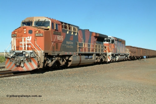 040810 150446r
Shaw Siding, BHP Billiton GE AC6000 6076 'Mt Goldsworthy' serial 51068 leads an all bubble paint quin consist on the main with EMD SD40R 3091 serial 31496 originally Southern Pacific SD40 SP 8415 and mid train units CM40-8M 5636 leading newly delivered SD40R units 3095 and 3096 10th August 2004.
Keywords: 6076;GE;AC6000CW;51068;