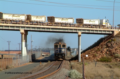 041001 152919r
Redbank Bridge, BHP Goninan GE rebuild CM40-8M 5650 'Yawata' serial 8412-07 / 93-141 notches back up into power as it passes the examiner doing his 'roll by' entering Nelson Point yard as a Doug Gould road train passes over the top. A very rare shot indeed! 1530 hrs 1st October 2004.
Keywords: 5650;Goninan;GE;CM40-8M;8412-07/93-141;rebuild;AE-Goodwin;ALCo;M636C;5481;G6061-2;
