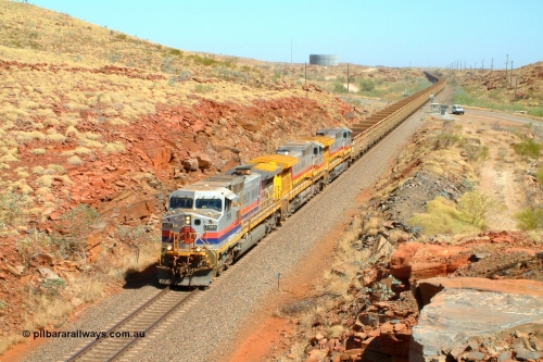 050110 094244r
Just south of Dugite Siding original liveried Hamersley Iron General Electric built Dash 9-44CW 7089 serial 47768 leads two similar Robe River units 9433 serial 54766 in Pilbara Iron livery and 9429 serial 54188 Pilbara Rail livery with an empty train at the 67 km grade crossing. Trailing unit 9429 was under test due to fluctuating power and workshops personal were on board the unit alighting at Gecko Siding. Monday 10th January 2005.
Keywords: 7089;GE;Dash-9-44CW;47768;