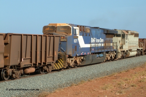 050204 080155r
Mooka, BHP mid train units of GE AC6000 6071 'Chichester' serial 51063 with the metal windscreen protecting blinds up and EMD SD40-2 unit 3083 serial 786170-2 originally Union Pacific UP 3500 at close to line speed of 80 kph/h at the 30 km, 4th February 2005.
Keywords: 6071;GE;AC6000CW;51063;