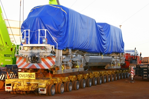 051022 6093r
Nelson Point hard stand area, BHP Billiton's brand new Electro-Motive built SD70ACe/LC unit 4301 serial 20038540-002 sits on the heavy haul float under its' tarp late in the afternoon light on the 22nd October 2005. It was unloaded the next morning.
Keywords: 4301;Electro-Motive;EMD;SD70ACe/LC;20038540-002;