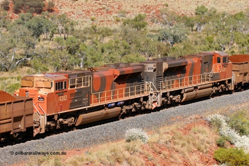 060714 6737r
Hesta, a brace of BHP Billiton Electro-Motive built SD70ACe/LC mid-train units 4302 'Mooka' serial 20038540-003 and 4311 'Poonda' serial 20038540-012 are in full power as they assist a loaded train climbing the grade at the 226 km. 14th July 2006.
Keywords: 4302;Electro-Motive-London-Ontario;EMD;SD70ACe/LC;20038540-003;