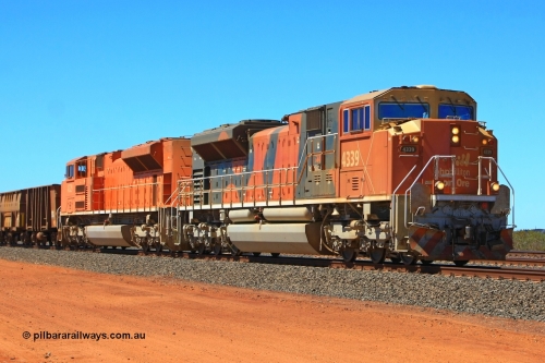 091001 2490r
Goldsworthy Junction on the Avoidance Road is BHP Billiton Electro-Motive built EMD model SD70ACe/LC locomotive 4339 with serial 20078915-006 from the fourth order of thirteen units as it leads an empty rake towards Bing with the second unit being an as yet unmodified SD70ACe Pumpkin locomotive 4329. 4339 was later on named Finucane and 4329 named Pilbara. 1st October 2009.
Keywords: 4339;Electro-Motive-London-Ontario;EMD;SD70ACe/LC;20078915-006;