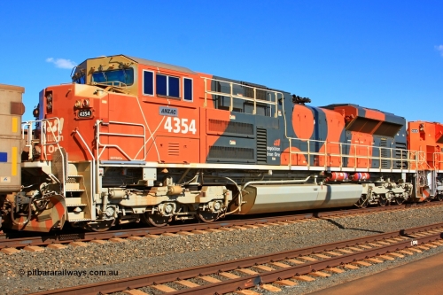 110208 9328r
Bing Siding, BHP Billiton's 4354 'ANZAC' an Electro-Motive built EMD SD70ACe unit with serial 20088019-008 from the fifth order of nine locos built in London Ontario. This image shows the ladder stirrups on the nose have been removed and there has been a trial set of sliding gates fitted to the gate to prevent a fall from heights when the step well plate is installed. This style of handrail didn't last long. 8th February 2011.
Keywords: 4354;Electro-Motive-London-Ontario;EMD;SD70ACe;20088019-008
