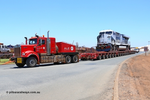 150129 7443
Port Hedland, Roy Hill's General Electric built ES44ACi unit RHA 1013 serial 62585 is their first locomotive to be delivered off the vessel Ocean Charger and being transported by ALE to Roy Hill's flash butt yard. Seen here leaving the Port Hedland port. 29th January 2015.
Keywords: RHA-class;RHA1013;GE;ES44ACi;62585;