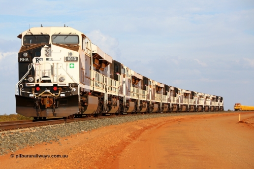 150412 7929r
Boodarie, north of the Flash Butt yard, Roy Hill's General Electric built ES44ACi units lined up on the mainline facing the port. RHA 1013 serial 62585, RHA 1012, RHA 1011, RHA 1010, RHA 1009, RHA 1014, RHA 1005, RHA 1006, RHA 1007, RHA 1008, RHA 1003, RHA 1004, RHA 1002 'Ginbata' and RHA 1001 'Ginny'. With a track supply train rake behind them. 12th April 2015. [url=https://goo.gl/maps/QVHp1]View map here[/url].
Keywords: RHA-class;RHA1013;GE;ES44ACi;62585;