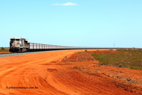 160319 1907
Great Northern Hwy, 18.2 km grade crossing, Roy Hill empty train #96 with General Electric built ES44ACi unit RHA 1006 serial 62578 leading 116 ore waggons with a mid-train unit visible then another 116 ore waggons. 16th March 2016. [url=https://goo.gl/maps/nEXZaaAHHa12]View map here[/url].
Keywords: RHA-class;RHA1006;GE;ES44ACi;62578;