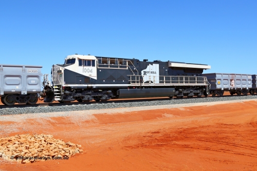160319 1920
Great Northern Highway 18.2 km grade crossing, Roy Hill empty train #96 with General Electric built ES44ACi unit RHA 1004 mid-train unit between 116 ore waggons in front and behind. 16th March 2016. [url=https://goo.gl/maps/nEXZaaAHHa12]View map here[/url].
Keywords: RHA-class;RHA1004;GE;ES44ACi;62576;