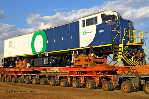 r251209 4846
Fortescue's new battery electric locomotive 601 being delivered to site after being built Progress Rail's EMD facility in Sete Lagoas, Brazil with a build date of October 2025 and serial number 20218349-001. These units tip the scales at 265 tonnes for a projected output of 7,600 horse power. December 9, 2025.
Keywords: 601;20218349-001;Progress Rail;EMD;SD70J-BB;
